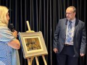 Heather and John with the painting